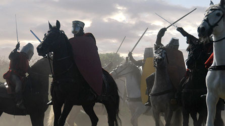 Photograph of a battlefield, with soldiers fighting on horseback