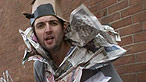 Maggot pictured wearing clothing made from newspapers