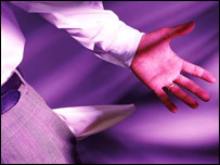 Someone holding an empty trouser pocket