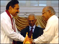 Wickramanayake (L) being appointed as PM by Rajapaksa