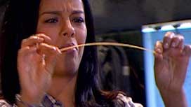 Liz about to snap dry spaghetti