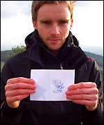 Kev proudly shows off his first stamp