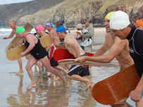 Some belly boarders heading into the water