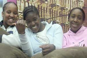 Texting and shopping keeps Keisha and friends sane...