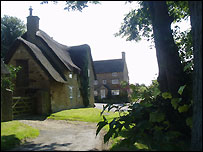 Thatched cottages on the green at Church Enstone