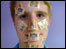 Man with stamps on his face