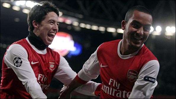 Nasri and Walcott celebrate another goal against Partizan