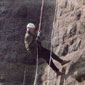 Still as active as ever, Jim abseils down the side of Scrabo tower for charity