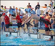 Relay swimmers change.