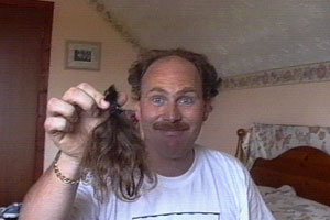 Mark has his ponytail removed