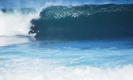 Right on it. Like some perfect Aussie or Hawaiian scene, Shamus catches this unnamed surfer on a hefty Donegal left hander. Pic: Shim 07