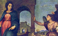 Young Mary is approached by an angel holding up its hand in a blessing gesture