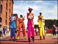 Beatles on stilts at Mersey River Festival