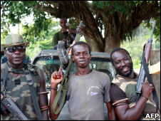 Pro-Ouattara forces are pictured with their weapons on March 28, 2011 in Blolequin, in western Ivory Coast.