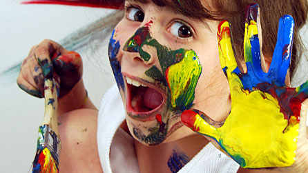 Photograph of a young girl covered in paint. Image from iStockPhoto.com, posed by model.