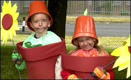 Children dressed up as flower pot men 