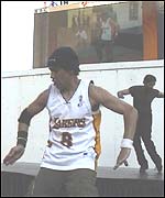 Sarajit and an urban dancer perform