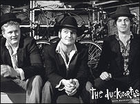 The Duckworths sit with some bicycles