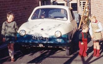 The family pose with the Nobel car
