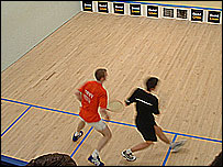 Squash players in action