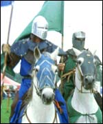 Knights on horseback jousting 