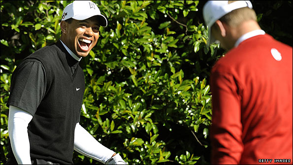 Tiger Woods shares a joke with Robert Karlsson