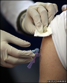 A man receives a vaccination against H1N1 swine flu in Berlin
