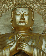 One of four gilded statues of Buddha 