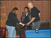 Emma Sharon and Adrian using the glass and table