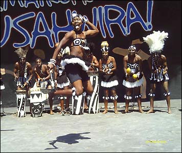 A dancer in traditional costume leaps to the beatFocus on Africa Magazines