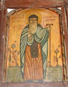 Religious icon of St Macarius among plants and carrying a tall two-headed staff