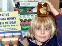Child with honey jar