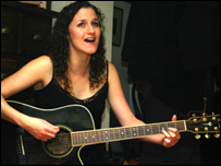 Lizzie Nunnery playing guitar.