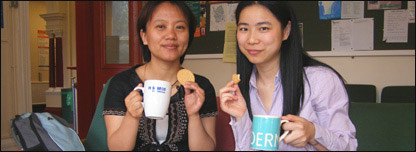 May taking a tea break with one of her classmates 
