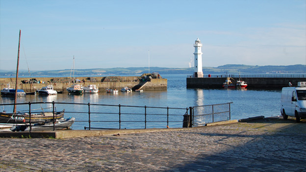 Colour view of Newhaven harbour where a number of small fishing and leisure boats are moored