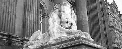 Statue of white lion outside Leeds Town Hall