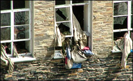 Debris hang from windows