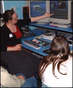 Participants at a Blink Film Festival workshop being shown how to use editing equipment 
