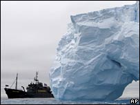 Iceberg with Sea Shepherd vessel behind