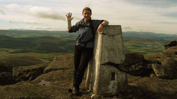 Woman standing at the summit of Ben Rinnes