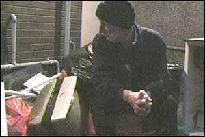 Paul looking at his ruin possessions.