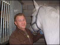 Rob Scott working in a stable