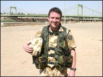 Ade in front of the 14th July Bridge