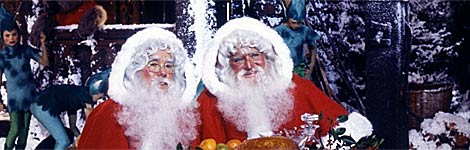 2 men dressed as Santa Claus