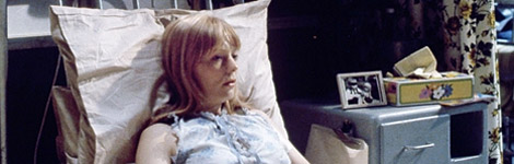 A woman in a hospital bed.