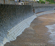 The base of the wall which is prone to erosion