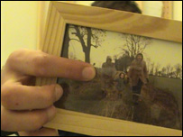 A photo of James with his mum and dad