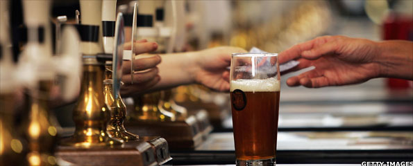 Beertaps and pint of ale