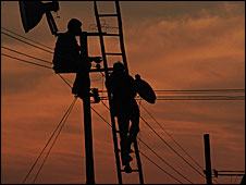 Indian engineers repairing an electric cable