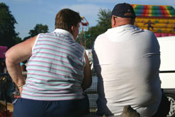 Back view of an overweight couple